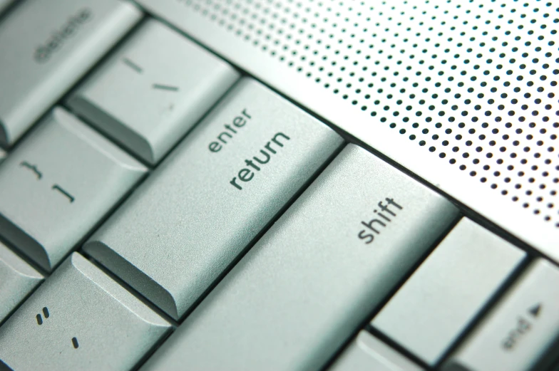 the keyboard has an embossed return on