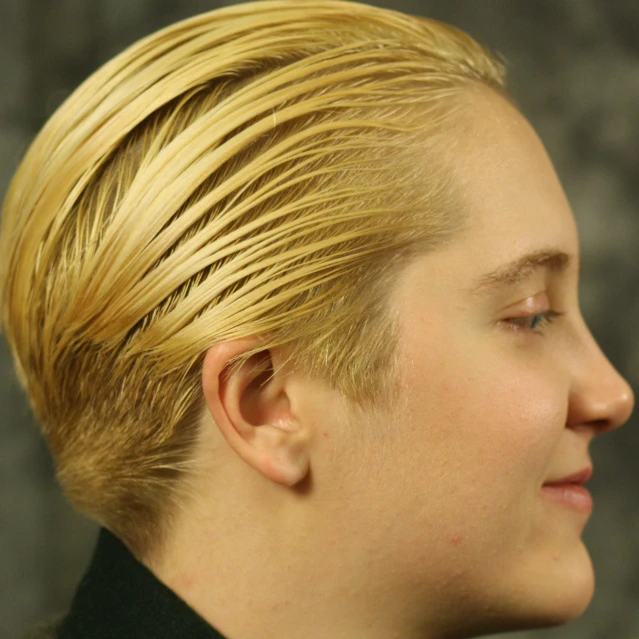 a blonde girl with a mohawk and blond hair