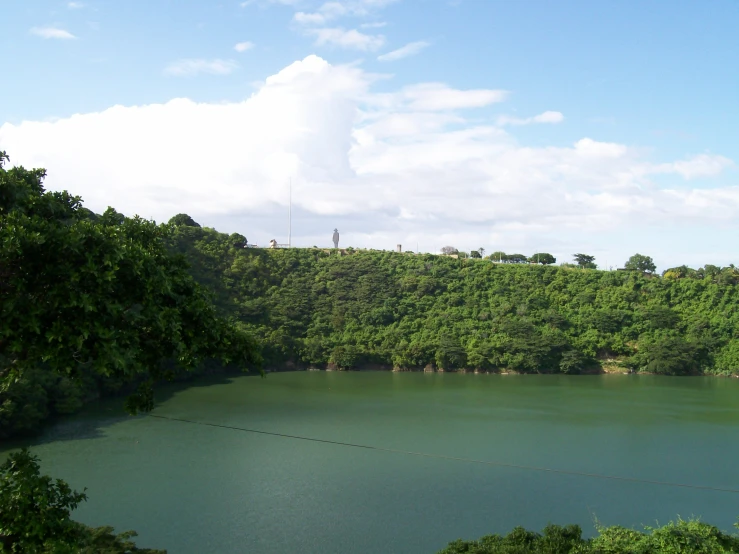 an area with many green trees and lakes