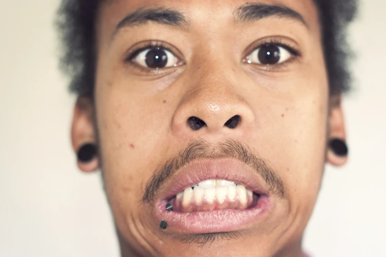 a close up of a person with no teeth