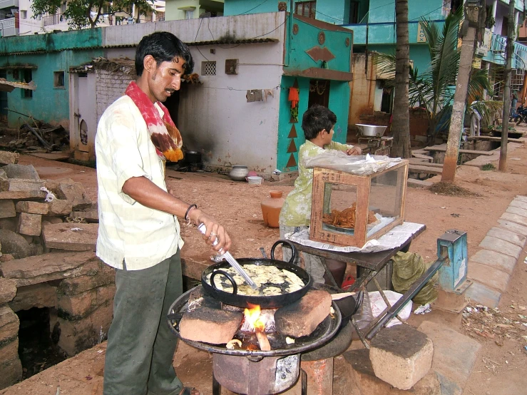 an image of man making a  plate food