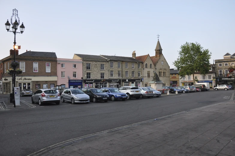 the cars are parked on the city street