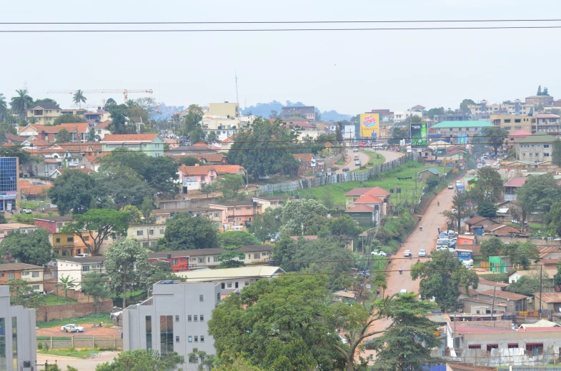 many houses line the hillside near an area where a traffic light is