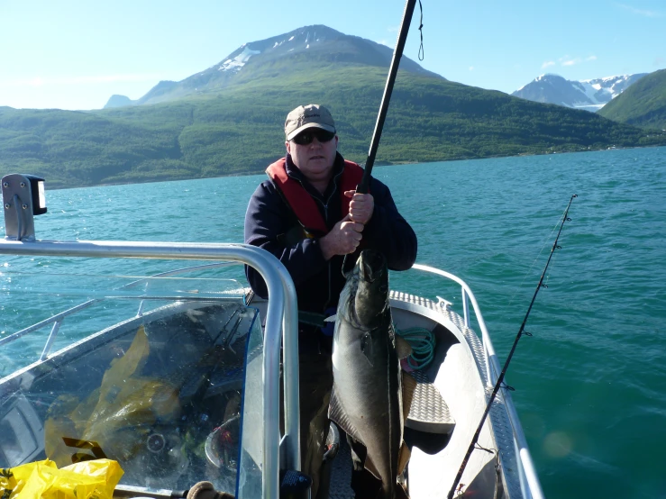 a man is fishing in the open water