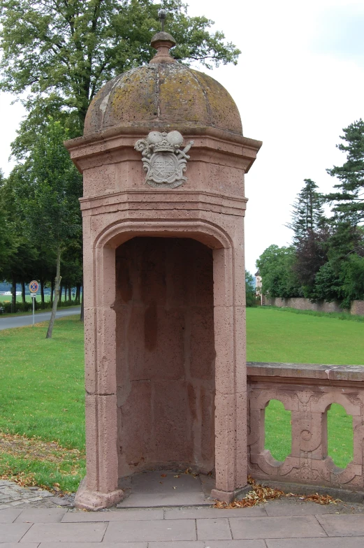 a decorative building made of bricks with a clock