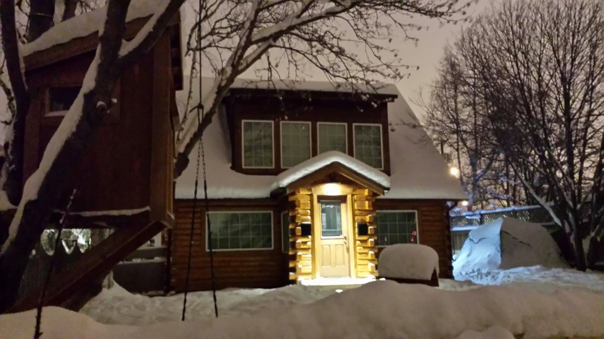 a large snow covered building sitting on the side of a road