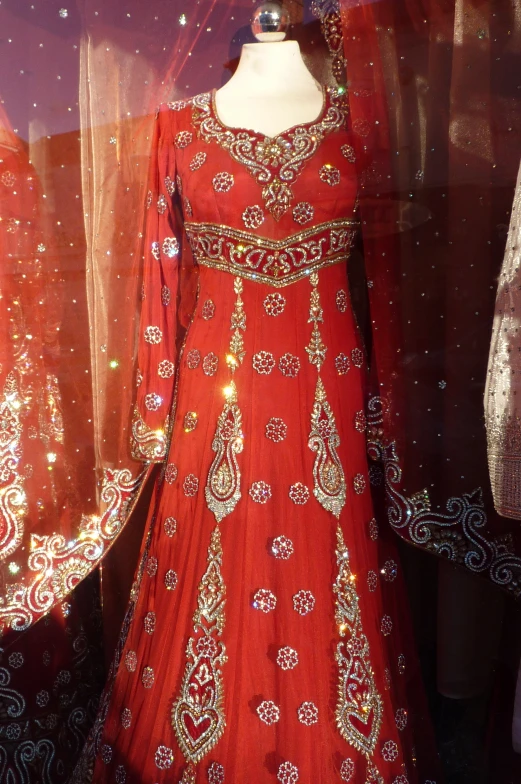 a display of a wedding gown with different colors