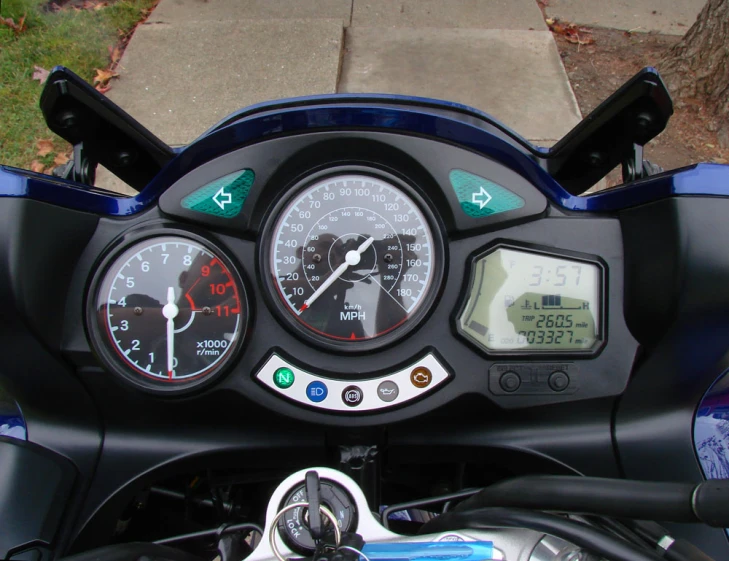 a close up s of the meters on a motorcycle