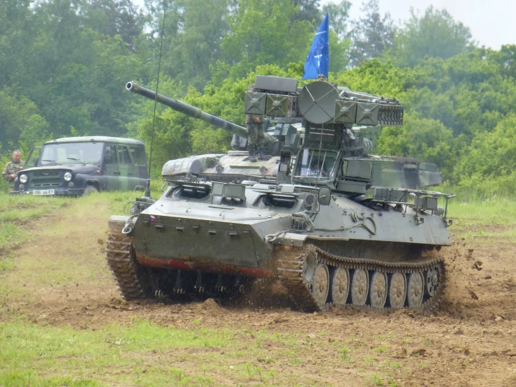 a military tank that is partially in the ground