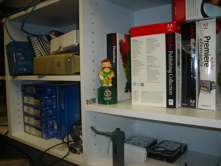 a shelf with books and other things on it