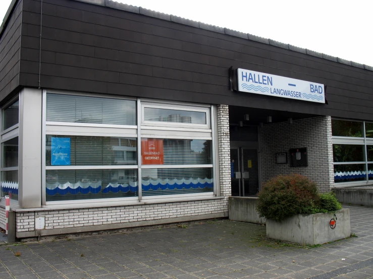 the front of a store with many window fronts