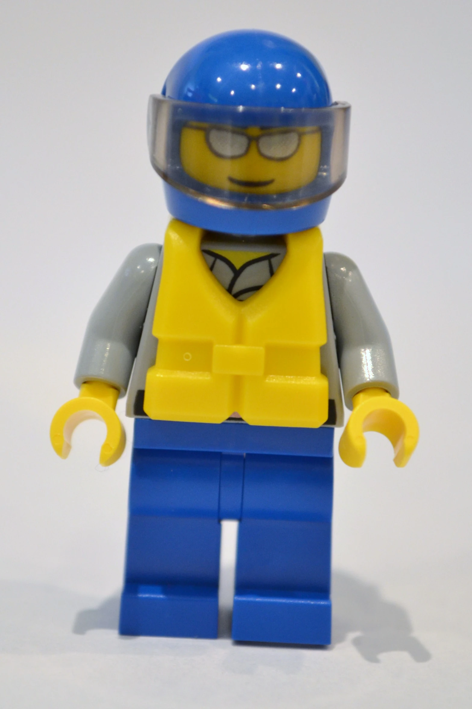 lego man with blue helmet and uniform with glasses on