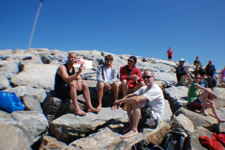 the group is relaxing at the very top of the mountain