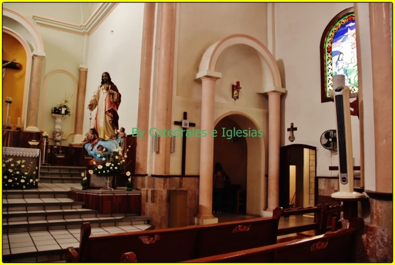 inside a church with some statues on display