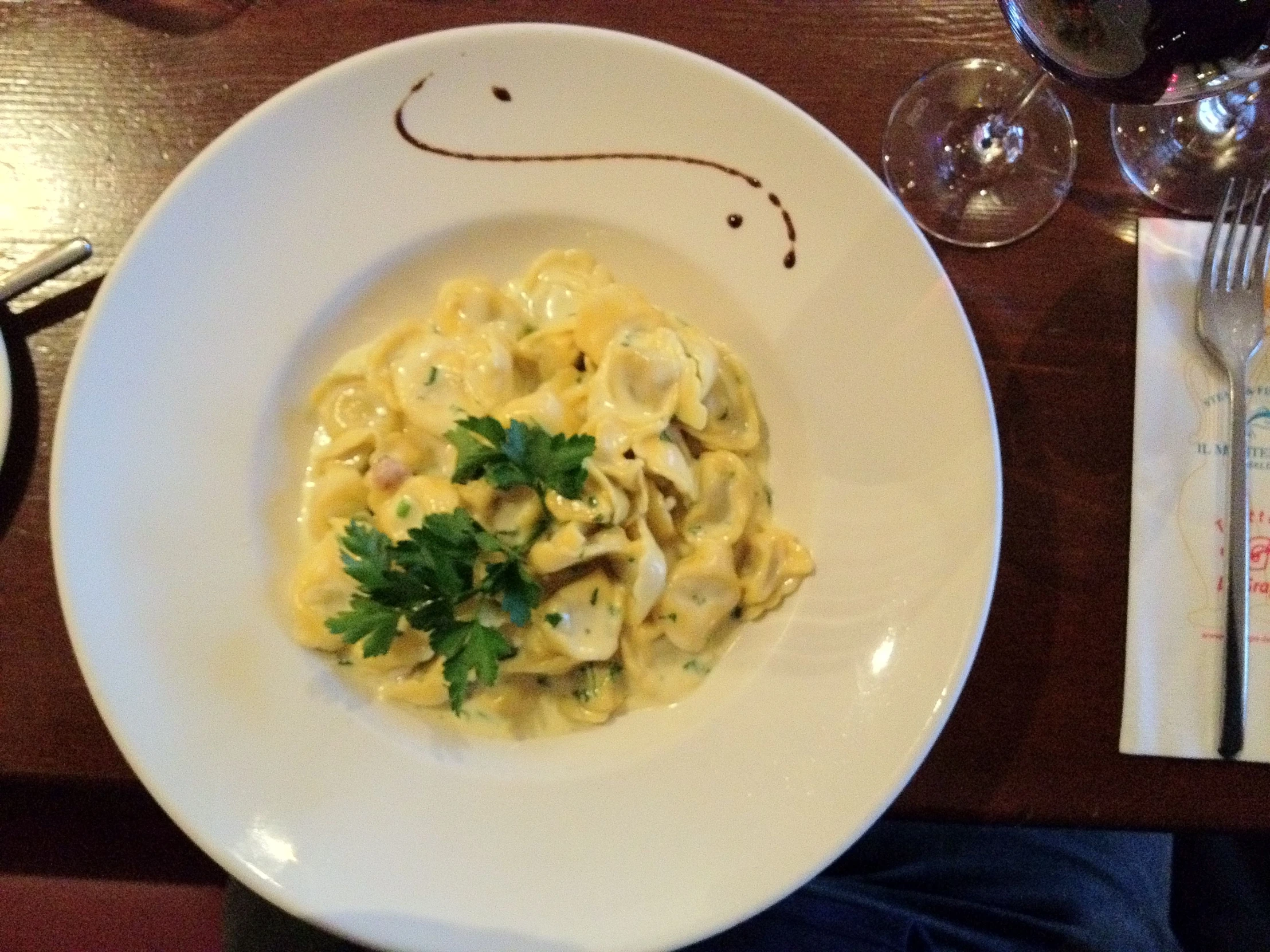 a plate of pasta sits on the table