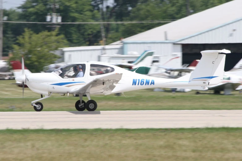 a small plane sitting on top of an airport runway