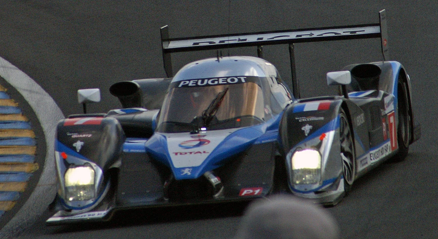 a racing car driving down a track