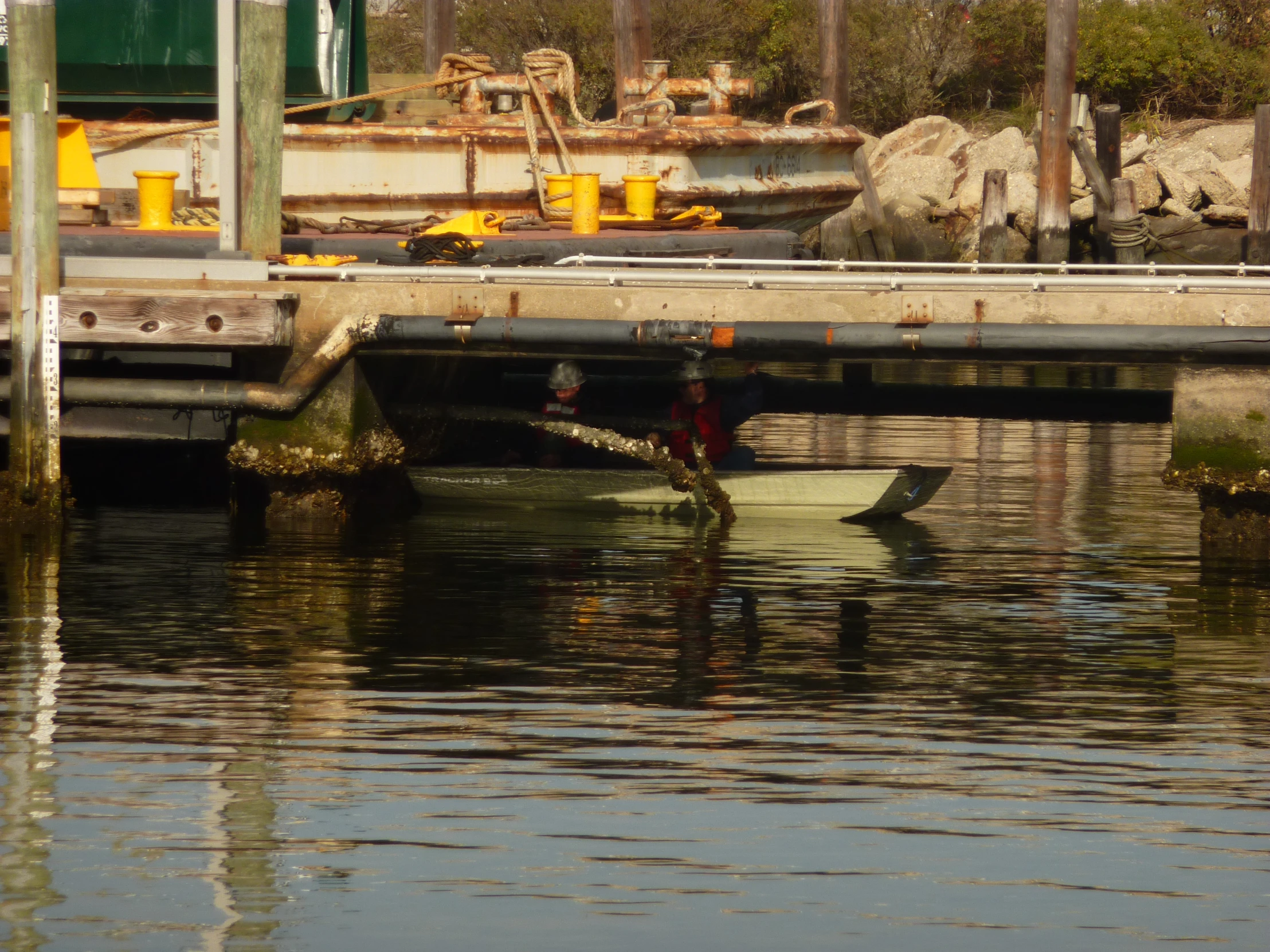 a person sitting in a row boat on a body of water