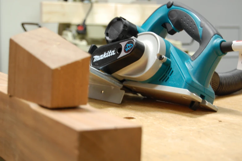 the corded sawing tool is on a  board