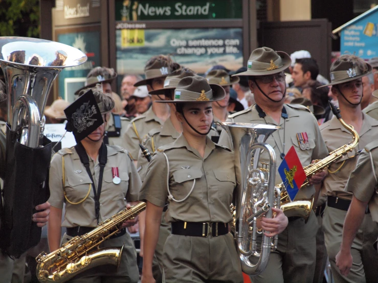a crowd of people wearing brown uniforms