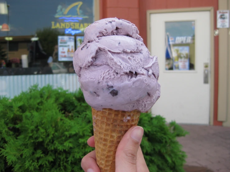 there is a purple ice cream cone with a sprinkle of lavender