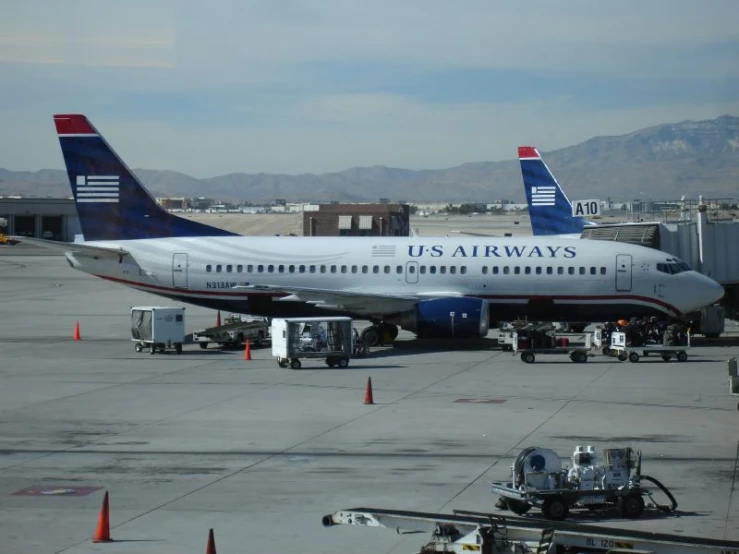 a passenger airplane is parked at the gate