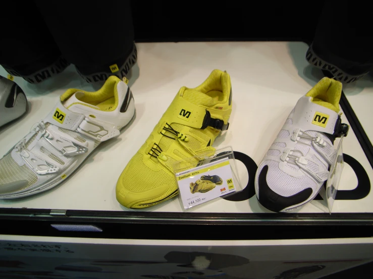 sneakers with tags on each side on display