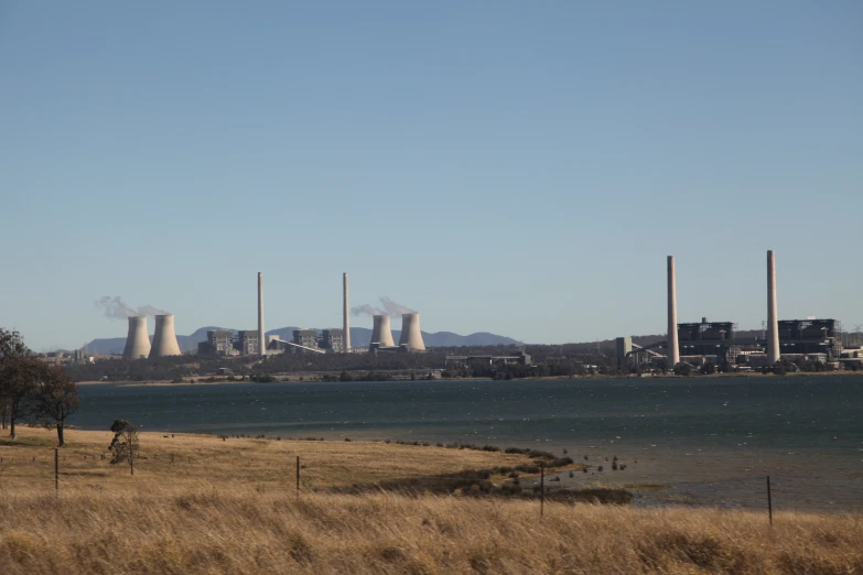 factory building and power station on the water in rural area