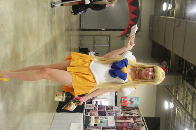 a women dressed as sailor moon posing for a po