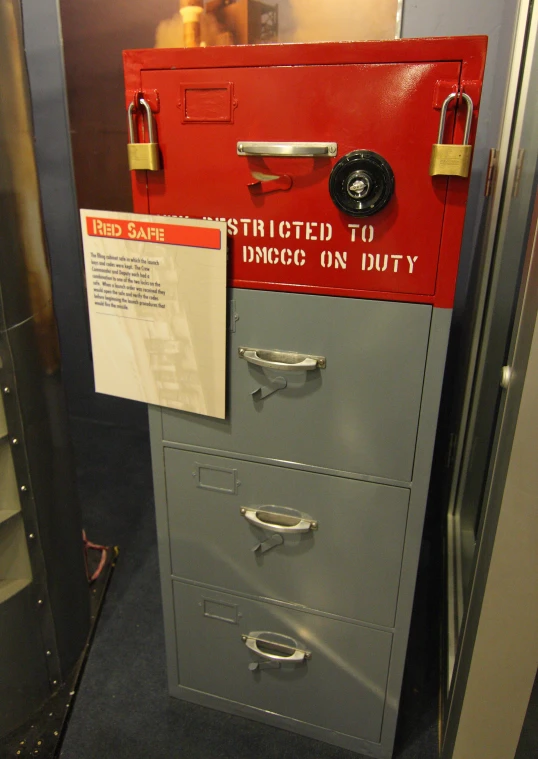 a closed file cabinet has a notice to draw on duty