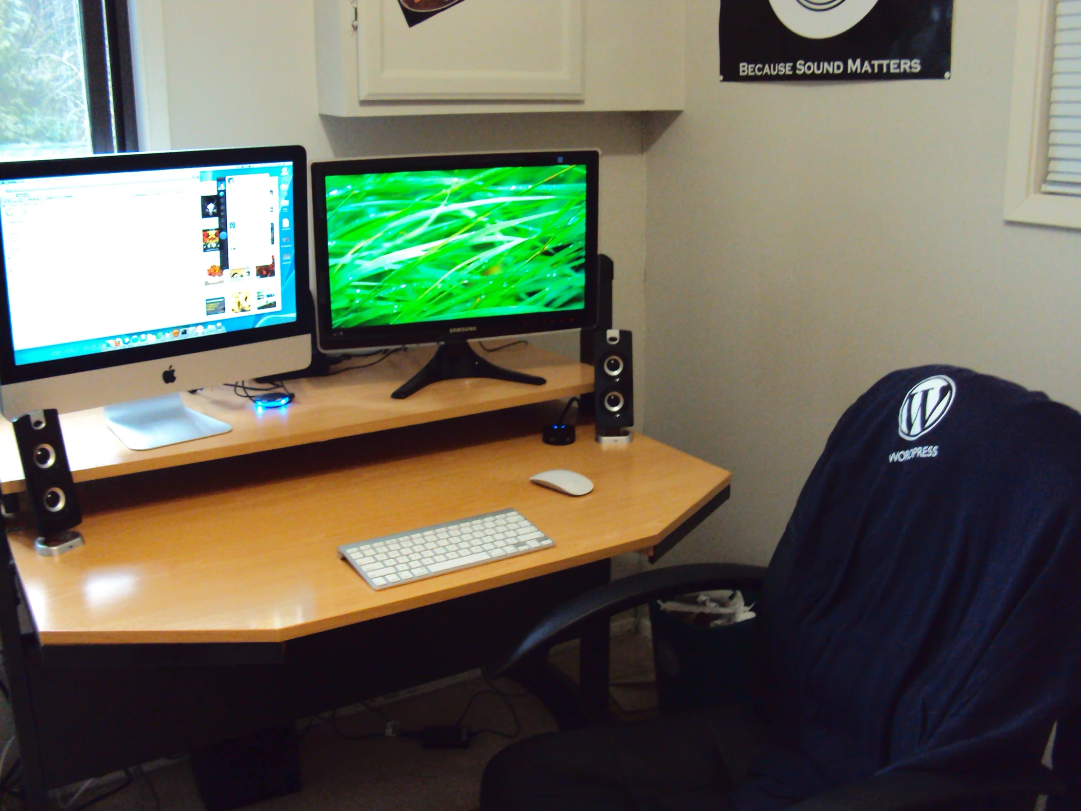 the computer monitor and keyboard are sitting on a desk