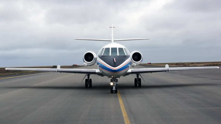 a propeller plane that is on the runway