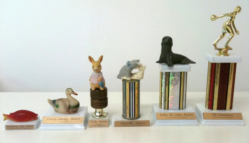 many ceramic animals are on a shelf