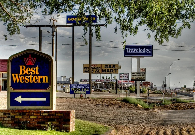 best western motel sign on the side of the road