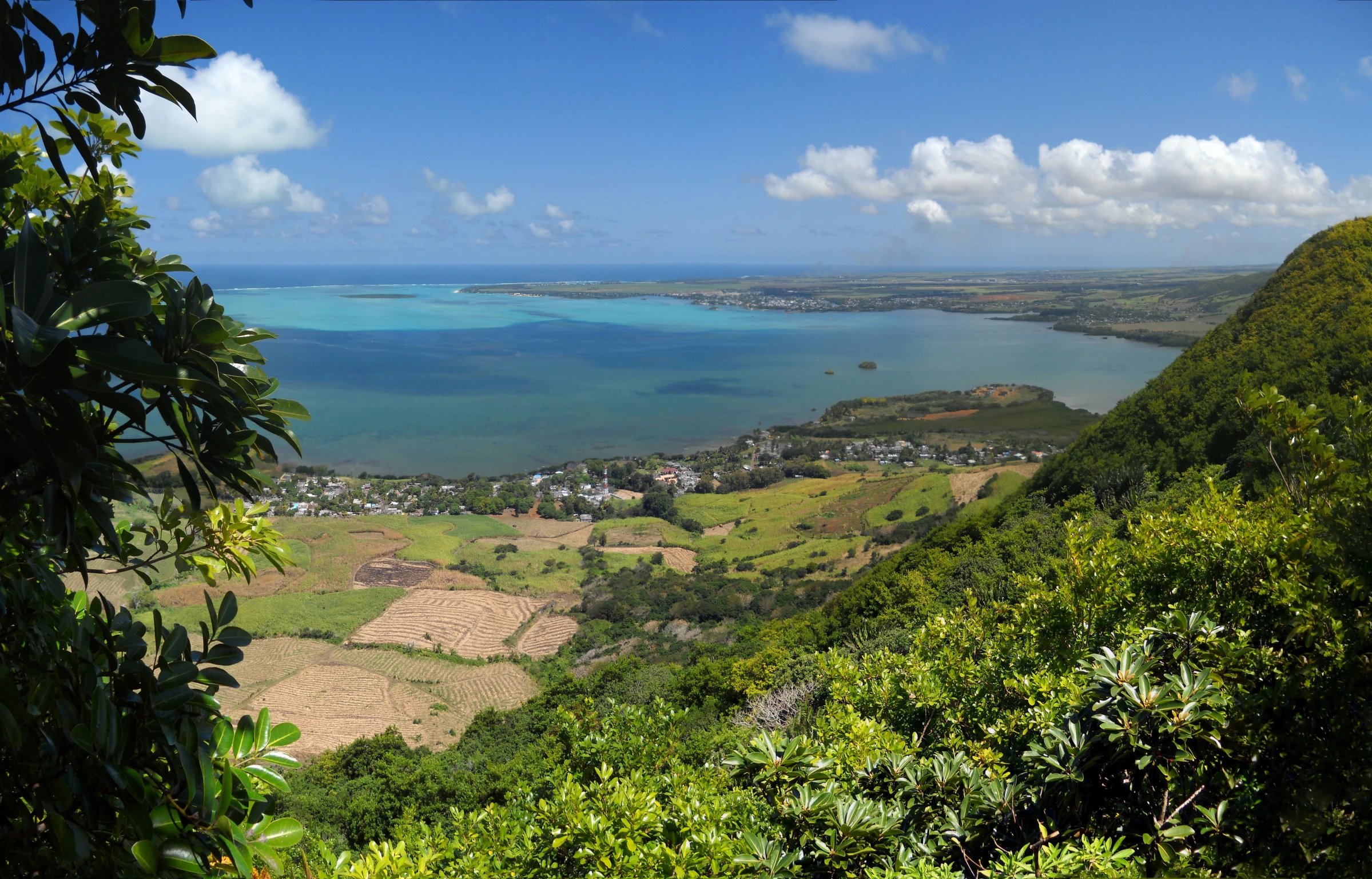 a picture from the side of a hill with lots of water