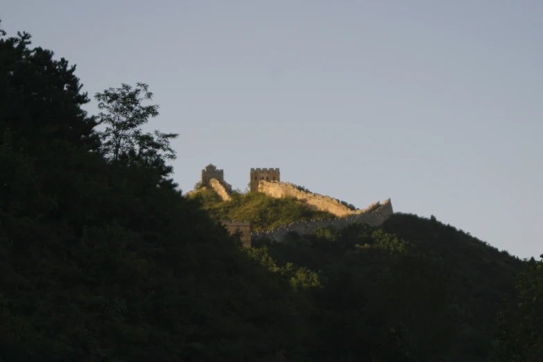 a castle sitting atop the top of a mountain