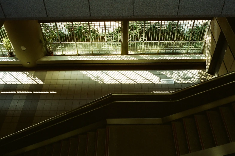 the stairwell of the building with tiled floors