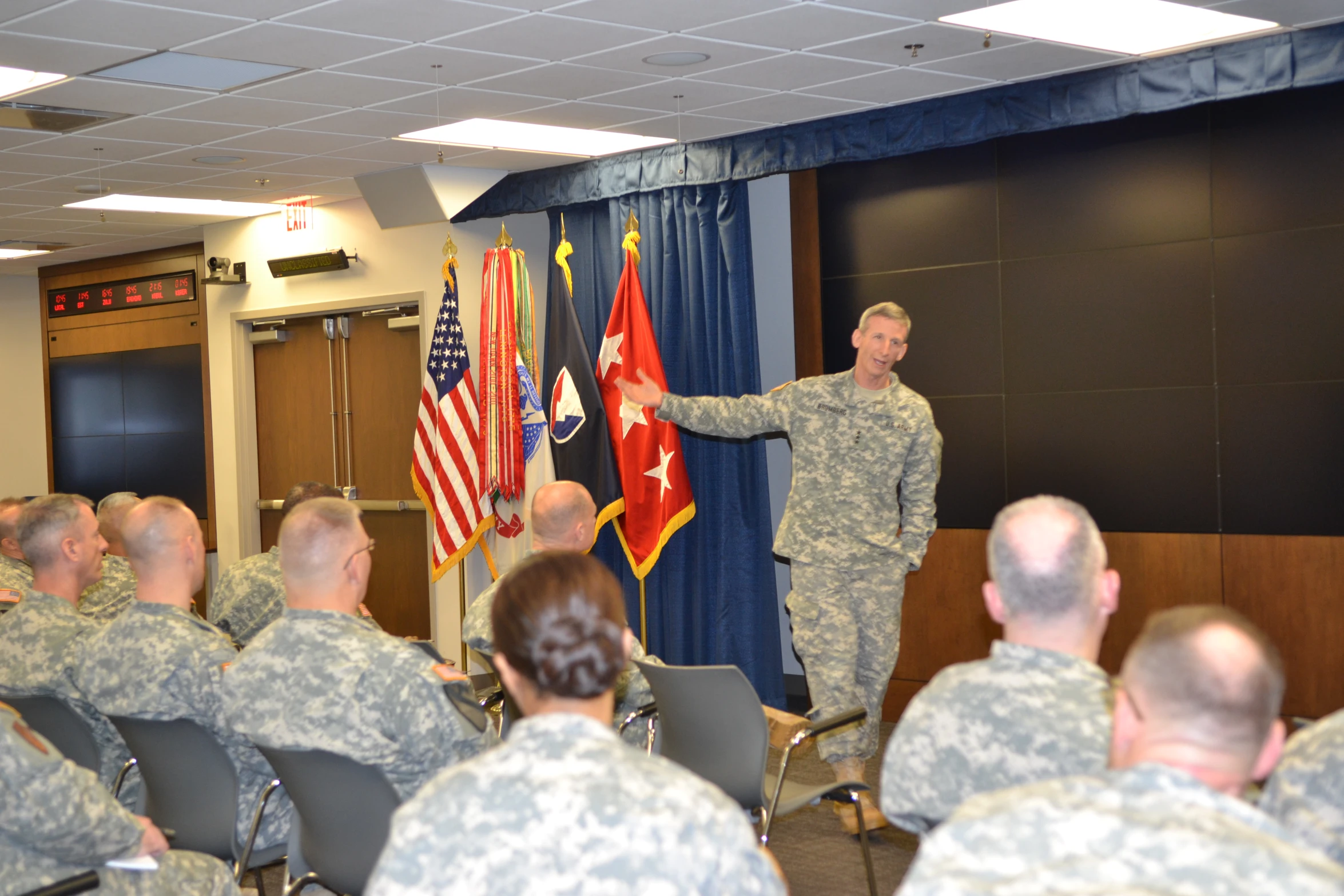 the military man is presenting his new flag