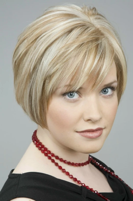 an attractive blonde woman with a sleek bob haircut