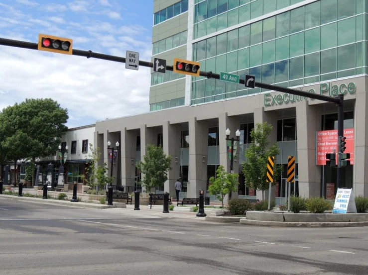 a street corner near an urban area, with a traffic light