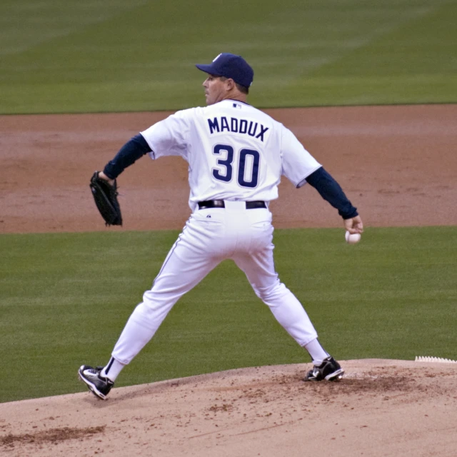 a man on a field throwing a baseball