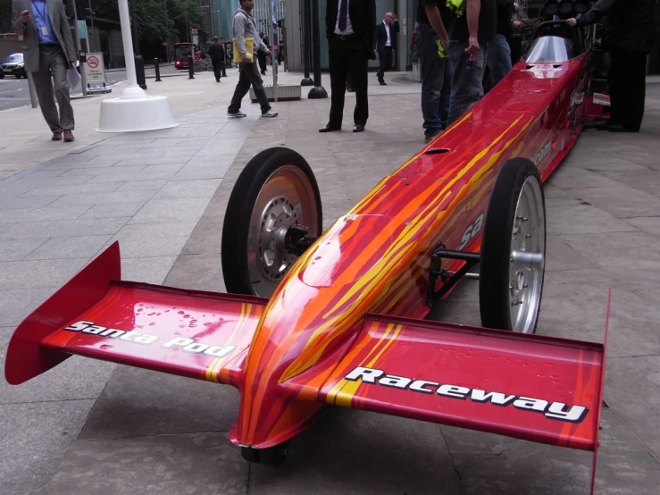 a very unusual looking racing vehicle on display