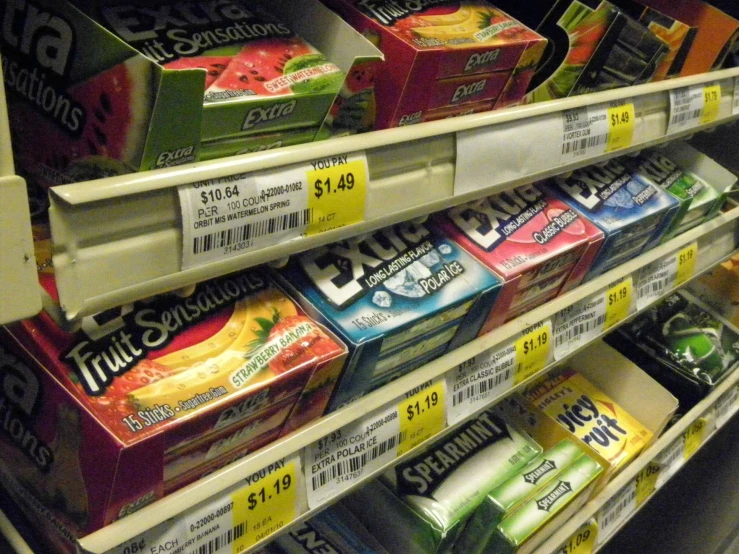 the shelf in the store has various types of snacks