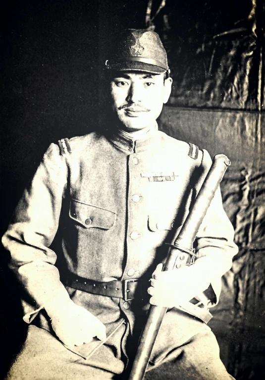 a black and white po of a man holding a baseball bat