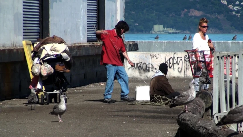 a group of people next to a bird