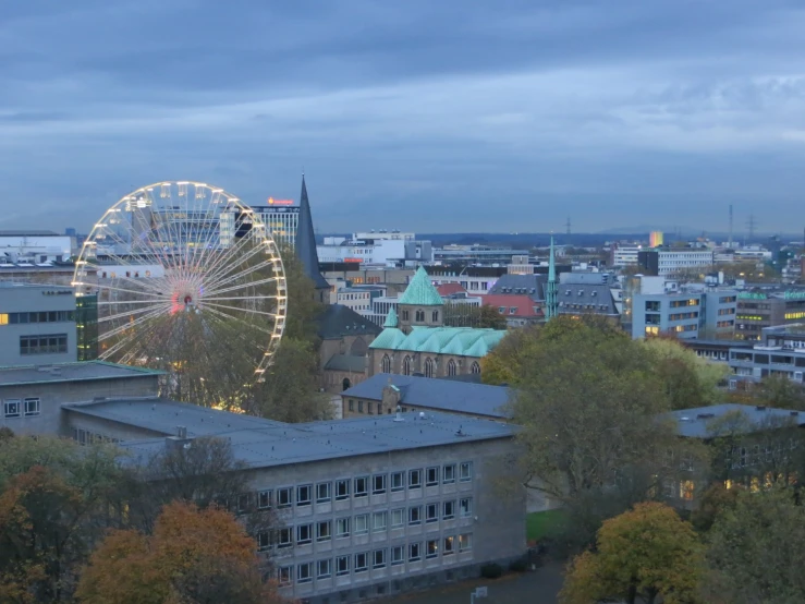 a cityscape with a ferris wheel in the center