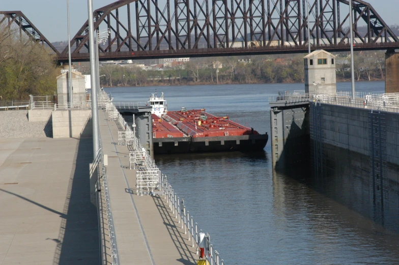 a large ship is entering the boat ramp on the river