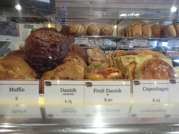 sandwiches, meatballs and desserts in a display case