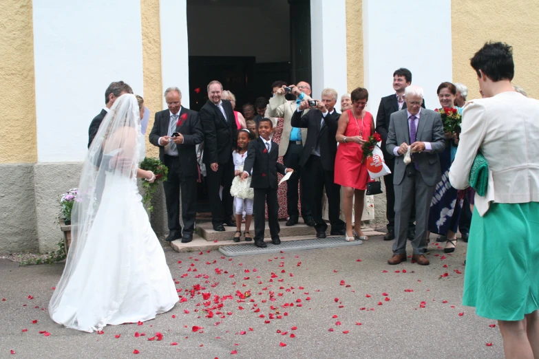 a bride and groom are about to leave the church