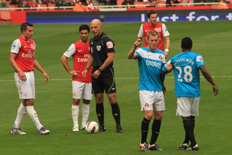 soccer players in their uniforms before a game